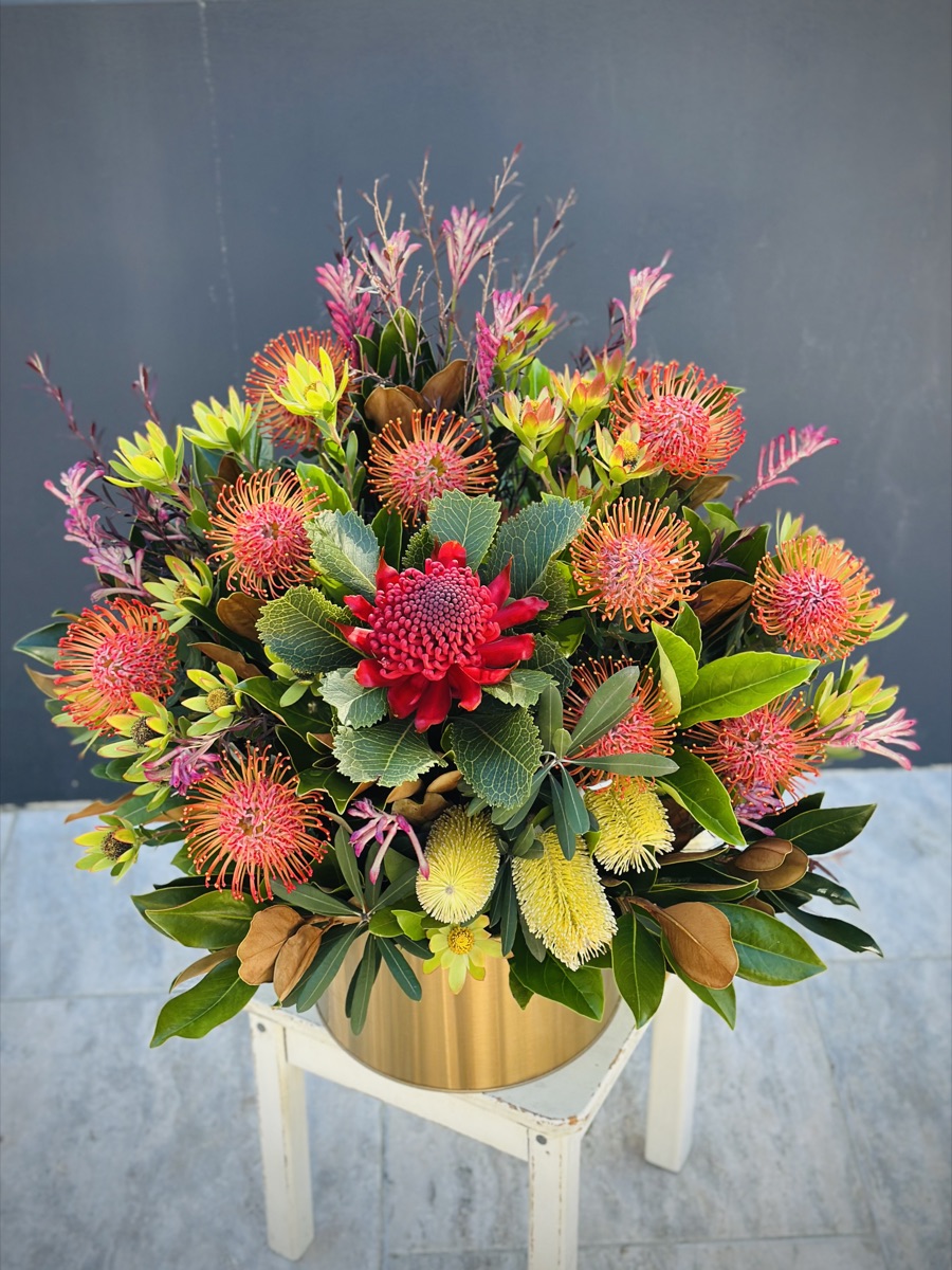 Native flower arrangement with red waratah, banksia and pincushion proteas by Harrington Park florist